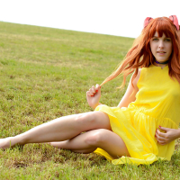 Amarna Miller poses in a beautiful yellow dress while outside
