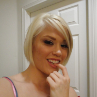 Young blonde hottie Ash Hollywood taking selfies in mirror while undressing