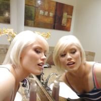Young blonde hottie Ash Hollywood taking selfies in mirror while undressing