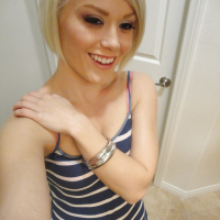 Young blonde hottie Ash Hollywood taking selfies in mirror while undressing