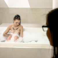 Lady Zee has fun with another babe in the bathtub