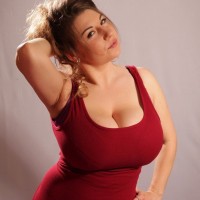 Busty babe Samanta Lily shows off her amazing boobs in a tight red top