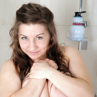 Busty Samanta Lily shows off her massive natural boobs in the shower