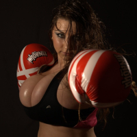 Samanta Lily dresses up as a boxer to show off her massive tits