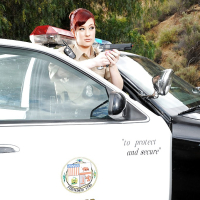 Redhead pornstar babe Jessica Ryan strips off police uniform outdoors