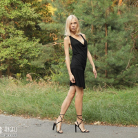 Beautiful young blond Nora Pace shamelessly strips and spreads in nature