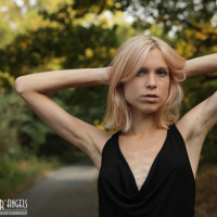 Beautiful young blond Nora Pace shamelessly strips and spreads in nature