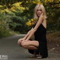 Beautiful young blond Nora Pace shamelessly strips and spreads in nature