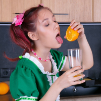 Sexy young chick Anna Blue squeezes an orange and spreads tight snatch
