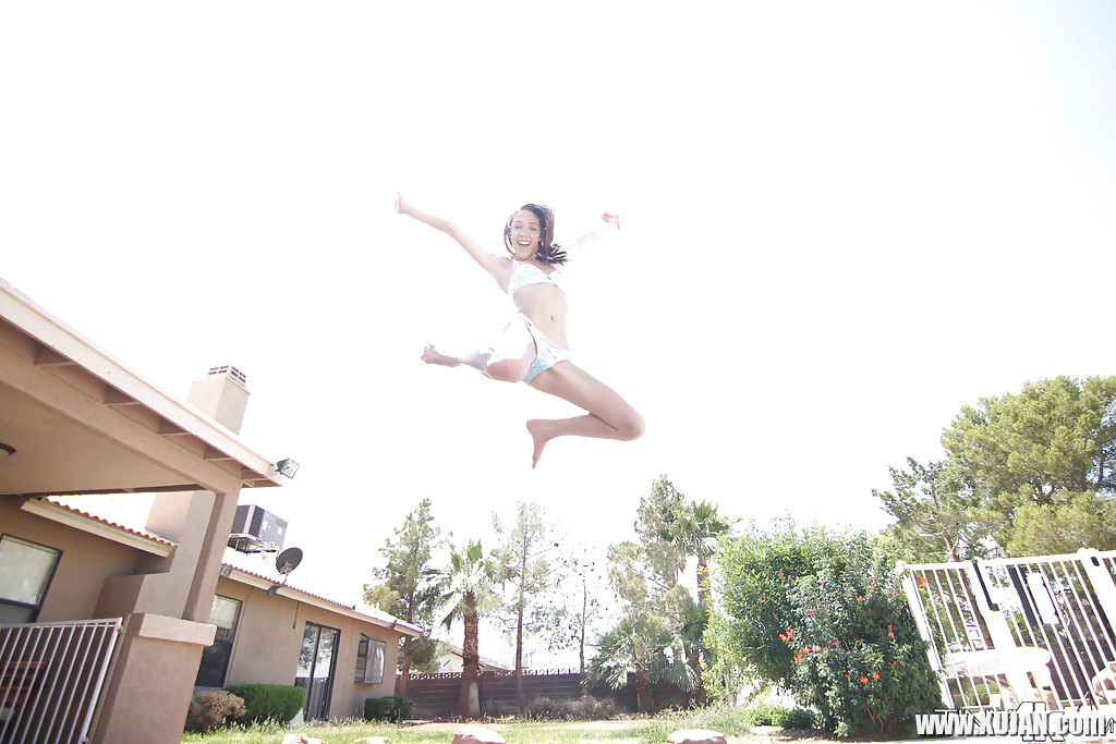 Leggy solo girl Lola Hunter poses outdoors beside swimming pool in bikini - Photo #1823997