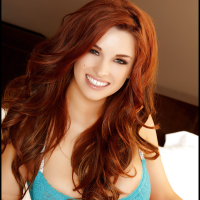 Big tits redhead Sabrina Maree poses in close up in her panties