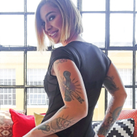 Kinky Kleio Valentien Strips and Poses Erotically