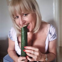 Naughty Lorna Blu having some fun with a big cucumber