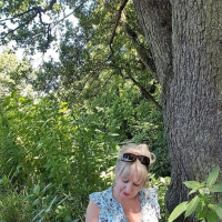 Sexy mature Lorna Blu showing her nice boobies outdoors