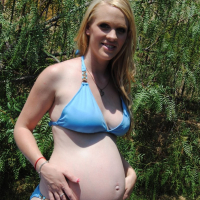 Pregnant Hydii May cools down in the Paddling Pool