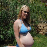 Pregnant Hydii May cools down in the Paddling Pool