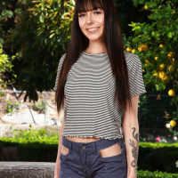 Good looking Emma Jade gets completely naked outdoors