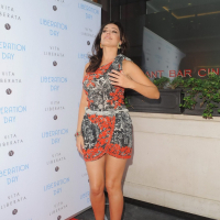 Kelly Brook leggy in an ultra short dress hosting the Liberation Day Campaign in