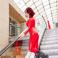 Lara Larsen posing in red Latex for Christmas