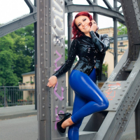Lovely Lara Larsen posing outdoors in blue Pants