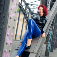 Lovely Lara Larsen posing outdoors in blue Pants
