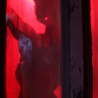 Patrick and Chloe creep along the dark alleys of the famous Red Light District s