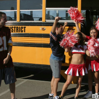 Three slutty cheerleaders starting a fervent orgy in the school bus