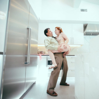 Pretty redhead babe Amber Addis fucked by an older man in the kitchen