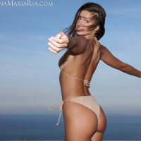 Melena Maria Rya teasing with her nice body in a tight bikini outdoors
