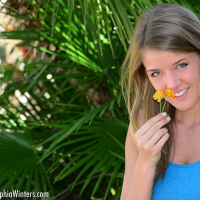Sophia wears a tight dress with matching panties and introduces her pink dildo