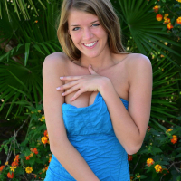 Sophia wears a tight dress with matching panties and introduces her pink dildo