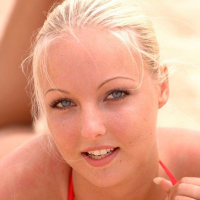 Pictures of Veronika Simon getting naked on the beach
