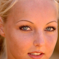 Pictures of Veronika Simon getting naked on the beach