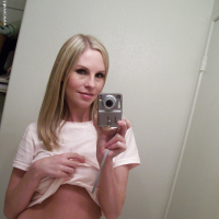 Big tit blonde Aimee undressing that stunning ass and pussy