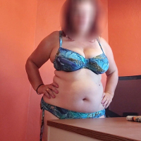 Chubby amateur girl in lingerie sitting by the desk