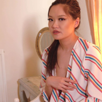 Asian chick Louisa Lu teases with her boobs through open blouse