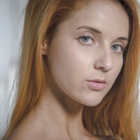 Roberta Bertis red hair falls on her tiny tits and shaved twat becomes wet