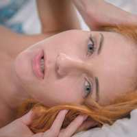 Redhead hottie Roberta Berti gets naked and waits for you in bed