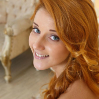 Redhead teen Roberta Berti strips nude and spreads for you in bed