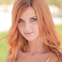 Redhead beauty Roberta Berti strips completely naked outside