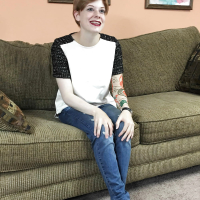 Redhead coed Ava Little shows off her tits