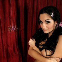 Little Miss Ava Addams sits on her panties by a spider