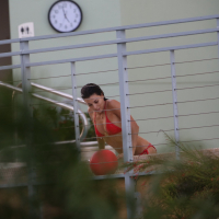 Eva Longoria shows off her round ass in a skimpy red bikini at the pool in Miami