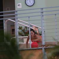Eva Longoria shows off her round ass in a skimpy red bikini at the pool in Miami