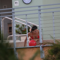 Eva Longoria shows off her round ass in a skimpy red bikini at the pool in Miami