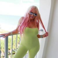 Busty Kelley Cabbana peels off her neon bodysuit to expose her amazing rack