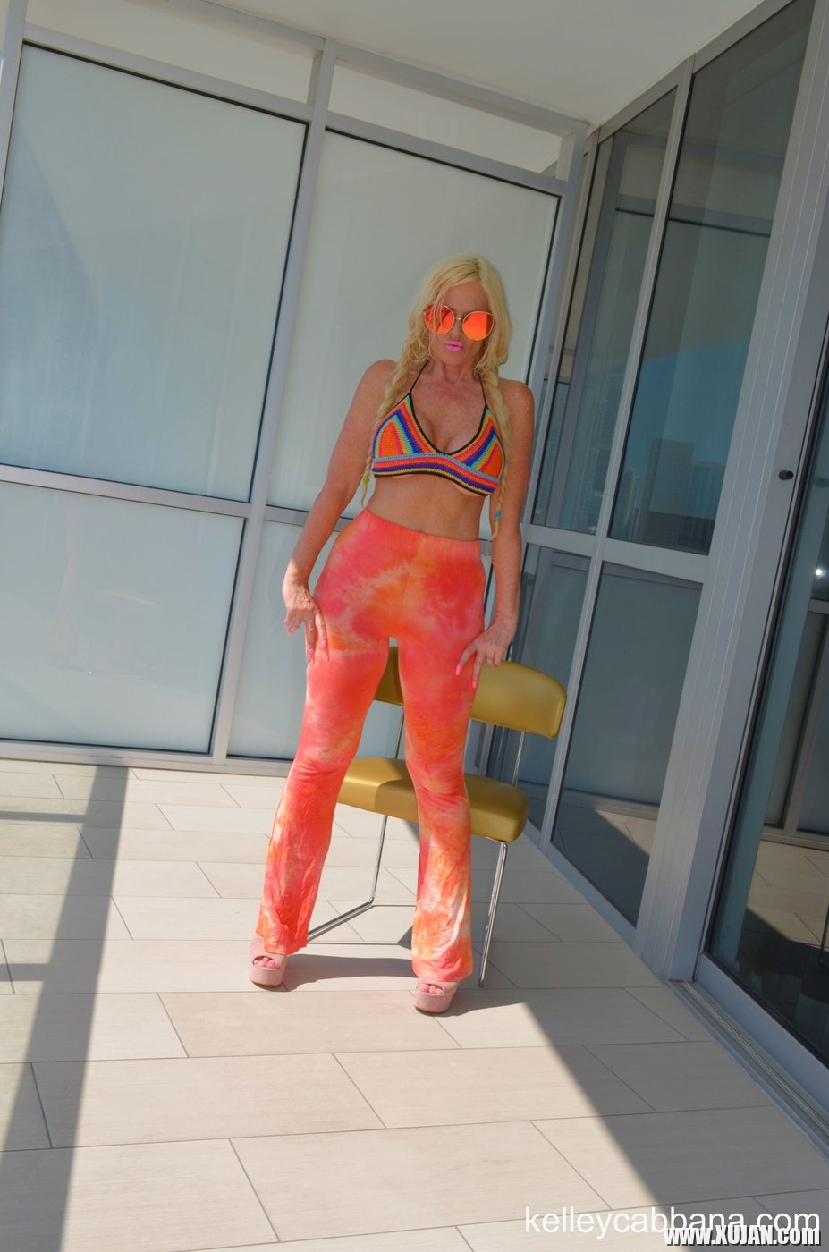 Hot busty MILF Kelley Cabbana poses topless on the balcony - Photo #2075858