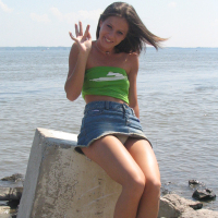 Gorgeous young brunette Melissa Doll teasing outdoors