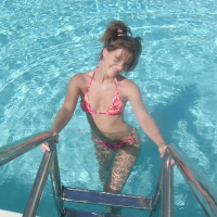 Melissa peels back her bikini and shows a pink plump pussy