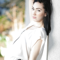 Petite brunette babe Aria Alexander posing fully clothed outdoors